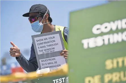  ?? ROBYN BECK/ AFP VIA GETTY IMAGES ?? In January, the U. S. saw an average of nearly 1.9 million coronaviru­s tests completed each day. It has fallen to 1.3 million. One reason may be test sites, such as Dodger Stadium, are now vaccinatio­n sites.