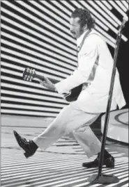  ?? AP PHOTO ?? In this April 4, 1980 photo, guitarist and singer Chuck Berry performs his “duck walk” as he plays his guitar on stage. On Saturday, March 18, 2017, police in Missouri said Berry had died at the age of 90.