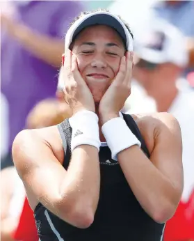  ?? AP FOTO ?? EASY WIN. Garbine Muguruza only gave up one game against Simona Halep in the final of the Western and Southern Open.