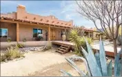  ??  ?? BURDON’S HOUSE
sits on 2.5 acres surrounded by native plants and encircled by an adobe wall.