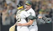  ?? THEARON W. HENDERSON GETTY IMAGES ?? Sean Manaea, right, and Jonathan Lucroy of the Athletics celebrate after Manaea pitched a no-hitter against the Boston Red Sox at the Oakland Alameda Coliseum on Saturday.