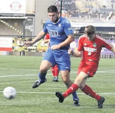  ??  ?? Alan Mark Owen (left - blue) netted for Llangefni in last Saturday’s impressive 5-0 success at Llandudno Albion Picture: DAI SINCLAIR