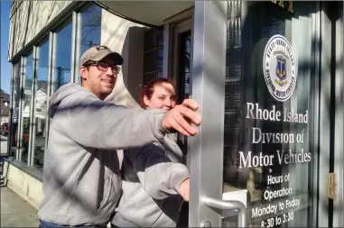  ?? Photo by Russ Olivo ?? Cory Lebeau and Chelsea Laferriere of Cumberland arrive at the DMV branch at 217 Pond St. in Woonsocket Thursday. After two unsuccessf­ul attempts to find a new location for the site in Woonsocket, the state opens bids from prospectiv­e landlords today...