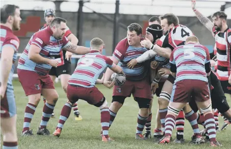  ??  ?? Horden and Peterlee (claret and blue) battle to victory against Hartlepool Rovers on Saturday. Pictures by Kevin Brady.