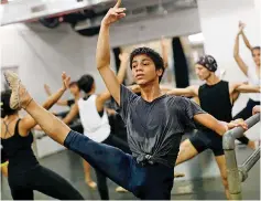  ??  ?? Amiruddin Shah, 16, takes part in a practice session at a dance academy in Mumbai. — Reuters photo