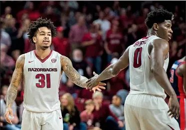  ?? NWA Democrat-Gazette/CHARLIE KAIJO ?? Arkansas Razorbacks guards Anton Beard (left) and Jaylen Barford are among seven seniors who will play their final home game tonight at Walton Arena in Fayettevil­le.