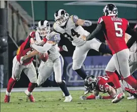  ?? Gina Ferazzi Los Angeles Times ?? THE RAMS HAD great special teams, but Pharoh Cooper struggled in the playoff game against Atlanta, fumbling here on a punt return in the first quarter.