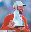  ?? AFP ?? Scottie Scheffler poses with the trophy after winning the Arnold Palmer Invitation­al.
