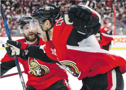  ?? JANA CHYTILOVA/GETTY IMAGES ?? Ottawa Senators forward Kyle Turris, right, celebrates his OT goal against the New York Rangers with teammate Tom Pyatt in Game 5 of their Eastern Conference semifinal Saturday at Canadian Tire Centre. The Sens lead 3-2 heading to New York for Game 6...