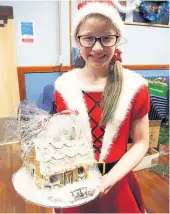  ??  ?? Winner Eva Barton (10) won the competitio­n for the best Christmas outfit