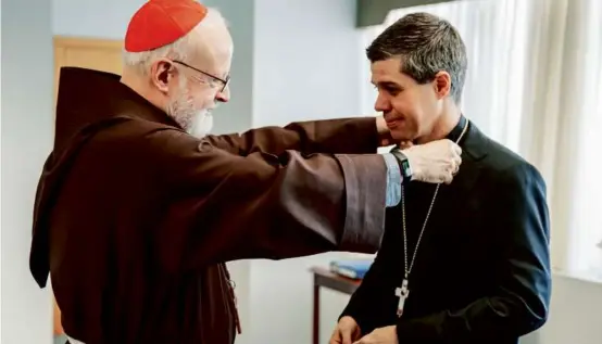  ?? GREGORY L.TRACY/THE PILOT ?? The Rev. Cristiano Barbosa (right) will be ordained as auxiliary bishop next year to assist Cardinal Sean P. O’Malley.