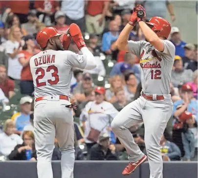  ?? AP ?? Paul DeJong of the St. Louis Cardinals celebrates his two-run home run with Marcell Ozuna during the sixth.