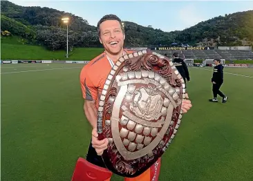  ?? PHOTOSPORT ?? Goalkeeper Kyle Pontefix was all smiles after his shootout heroics helped Capital win the men’s final in the national hockey league in Wellington yesterday.