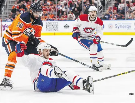  ?? JASON FRANSON/THE CANADIAN PRESS ?? Habs forward Andrew Shaw is tripped up by Jujhar Khaira of the Oilers in a 4-1 loss in Edmonton this month.