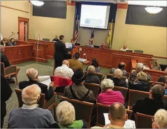  ?? NICK BLIZZARD / STAFF ?? A proposal to build 88 homes north of the Dayton Mall drew more than 70 people — many who question the plan — to a Miami Twp. Zoning Commission meeting last month.