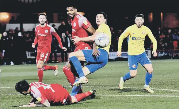  ?? ?? Sunderland striker Ross Stewart is closed down by an Accrington Stanley defender.