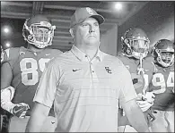  ?? AP/JAE C. HONG ?? The No. 4 Southern Cal Trojans, led by Coach Clay Helton (middle), have won 11 consecutiv­e games, including last season’s Rose Bowl.