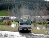  ?? HAMISH MCNEILLY/STUFF ?? Floodwater remains at a new subdivisio­n in Outram, near Mosgiel.