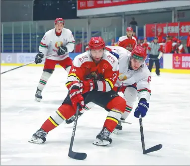  ?? PROVIDED TO CHINA DAILY ?? Team China, featuring players invited to Kunlun Red Star’s evaluation camp in Beijing, dropped a 5-2 decision to the Belarus U25 national team at Ao Zhong Ice Sports Club on March 22. China’s national squad is preparing for the April 23-29 IIHF...