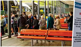  ?? ?? Queue here: Passengers wait at Buchanan Bus Station in Glasgow, above. Right: Stark notice to train travellers in Aberdeen