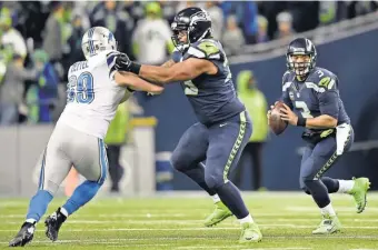  ?? STEVEN BISIG, USA TODAY SPORTS ?? The Seahawks offensive line gave RussellWil­son time to pass for 224 yards and two touchdowns in the team’s wild- card win.