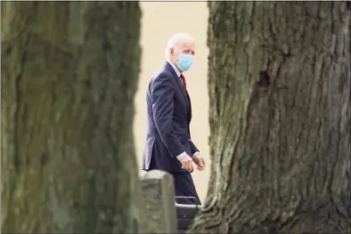  ?? Susan Walsh / Associated Press ?? President-elect Joe Biden arrives for mass at St. Joseph on the Brandywine Catholic Church in Wilmington, Del., on Dec. 8.