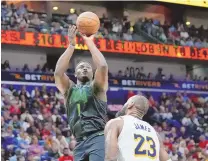  ?? ASSOCIATED PRESS ?? New Orleans Pelicans forward Zion Williamson shoots over Los Angeles Lakers forward LeBron James in the second half of Sunday’s regular-season finale for both teams. The same teams meet on Tuesday in the NBA’s play-in round.