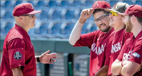  ?? NWA Democrat-Gazette/BEN GOFF ?? Arkansas pitching coach Wes Johnson (far left) talks to pitchers (from left) Isaiah Campbell, Blaine Knight and Matt Cronin on Sunday during practice at TD Ameritrade Park in Omaha. Knight is scheduled to start tonight with Campbell to get the nod for an if-necessary Game 3.