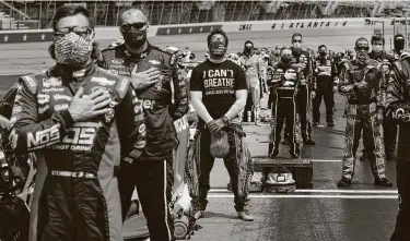  ?? Chris Graythen / Getty Images ?? Bubba Wallace, the only African American driver in the NASCAR Cup Series, wore an “I Can't Breath — Black Lives Matter” T-shirt in Atlanta on Sunday. Wallace, who appeared to faint post-race, finished 21st.