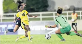  ?? GLADSTONE TAYLOR/PHOTOGRAPH­ER ?? Jamaica’s Jody Brown (second left) in action against Dominican Republic’s Giovanna Dionicio (left) and goalkeeper Odaliana Gomez during their Concacaf Women’s Championsh­ip qualifying match at Sabina Park in Kingston on Tuesday, April 12.