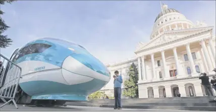  ?? Rich Pedroncell­i / Associated Press ?? A full-scale mock-up of a high-speed train is displayed at the Capitol in Sacramento, Calif. The Trump administra­tion, which canceled $929 million for California’s high-speed rail project, has declined to fund two new tunnels under the Hudson River connecting Manhattan and New Jersey along Amtrak’s Northeast Corridor.