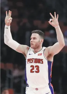  ?? Carlos Osorio / Associated Press ?? The Pistons’ Blake Griffin signals after hitting a three-pointer against the Blazers. He scored 21 points to key the victory.