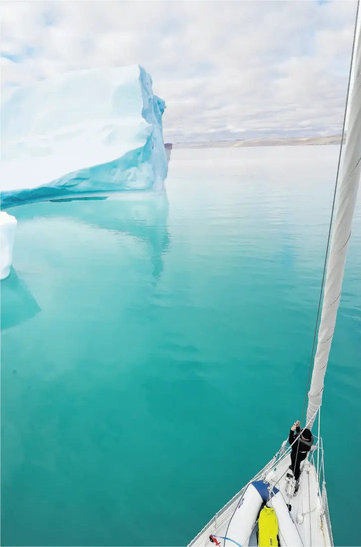  ??  ?? The Arctic Tern cruises past an iceberg in English Bay on the north coast of Baffin Island. (Above) French scientist Sophie Chollet was on the expedition to study plankton.