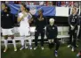  ?? JOHN BAZEMORE - THE ASSOCIATED PRESS ?? FILE - In this Sept. 18, 2016, file photo, United States’ Megan Rapinoe, right, kneels next to teammates Christen Press (12), Ali Krieger (11), Crystal Dunn (16) and Ashlyn Harris (22) as the national anthem is played before the team’s exhibition soccer match against the Netherland­s in Atlanta.
