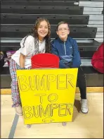  ?? ?? Kaleigha Morris and Aden Shumate passed out candy for Bumper to Bumper. Some older students helped pass out candy for younger students in costume.