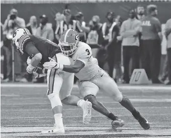  ?? CAITLYN TAM/GEORGIA PHOTO ?? Former Georgia inside linebacker Roquan Smith, shown here in last December’s Southeaste­rn Conference championsh­ip game, had three jerseys stolen out of his car last weekend. The jerseys were found late Tuesday night.