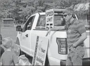  ?? Spencer Lahr / Rome News-Tribune ?? Alto Park Elementary students Kenterris Curry (from left) and CJ Shaw listen to Brandon Clayton, a Georgia Department of Transporta­tion engineer, speak about what the GDOT does and what is included in the role of an engineer.