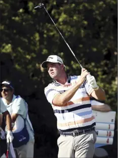  ?? AP via The Dallas Morning News / ANDY JACOBSOHN photo ?? Marc Leishman tees off on the 18th hole during the first round of the AT&T Byron Nelson on Thursday.