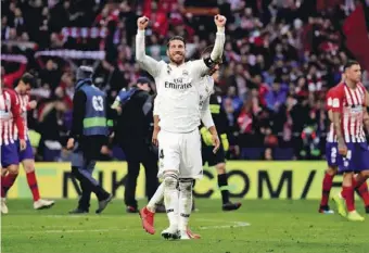  ??  ?? Sergio Ramos celebrates team's victory after a match between Atletico Madrid and Real Madrid