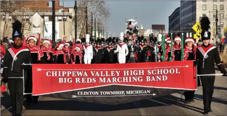  ?? PHOTOS BY GEORGE SPITERI — FOR THE MACOMB DAILY ?? Members of the Chippewa Valley Big Reds Marching Band made their presence known Thursday on Woodward Avenue in downtown Detroit.