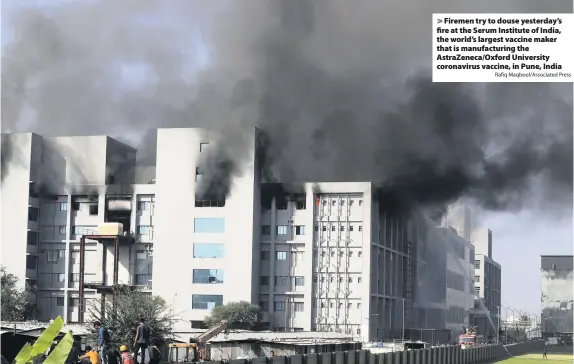  ?? Rafiq Maqbool/Associated Press ?? Firemen try to douse yesterday’s fire at the Serum Institute of India, the world’s largest vaccine maker that is manufactur­ing the AstraZenec­a/Oxford University coronaviru­s vaccine, in Pune, India