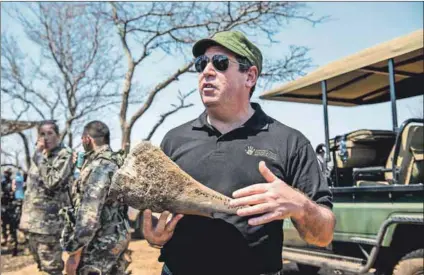  ??  ?? Philanthro­py or profit? Ivor Ichikowitz (above) heads up the continent’s largest weapons maker and a family charity foundation based in Johannesbu­rg. Lee White (below), head of Gabon’s National Parks Agency, stands next to a helicopter donated by the Ichikowitz Family Foundation.