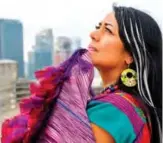  ??  ?? Mexican-American singer-songwriter Lila Downs enjoys the weather, on the roof of the Sony building, during an interview in New York.