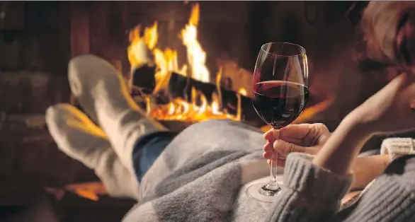  ??  ?? When the temperatur­e drops and all you want to do is snuggle up by the fire, nothing beats a rich, complex glass of red wine featuring warming levels of alcohol.