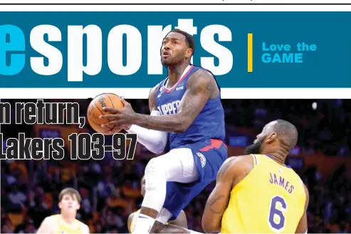  ?? MARK J▪ TERRILL/AP PHOTO ?? LOS ANGELES Clippers guard John Wall, left, shoots as Los Angeles Lakers forward Lebron James defends during the first half of an NBA basketball game Thursday, Oct▪ 20, 2022, in Los Angeles▪