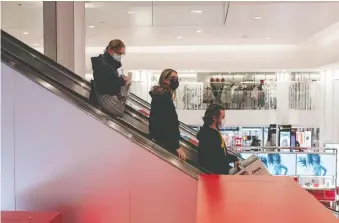  ?? SCOTT HEINS/ GETTY IMAGES ?? Shoppers seek out last-minute gifts at Macy's flagship store in Manhattan on Christmas Eve. Spending growth in the goods sector actually benefited from the pandemic, writes David Rosenberg.