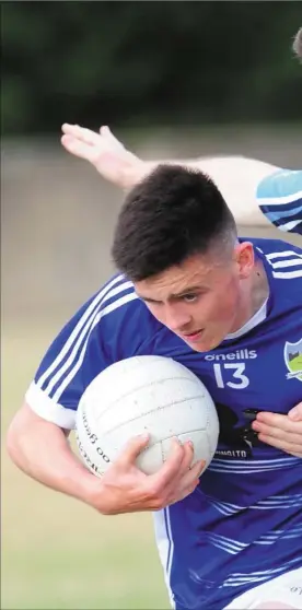  ??  ?? Liam Dawe, Roche Emmets is tackled by Céin Sheridan, Glyde Rangers during