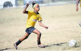  ?? RICARDO MAKYN/CHIEF PHOTO EDITOR ?? Norbrook Strikers’ Orania Campbell goes on a dribble during one of the Youth Football League’s Junior Cup all-island games at the University of the West Indies’ Mona Bowl in February.