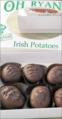  ?? PHOTO BY EMILY RYAN ?? Dark chocolate covers these Oh Ryan’s Irish Potatoes.