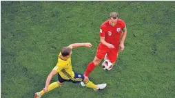  ??  ?? GETTY IMAGES England’s Harry Kane (R) in action against Ludwig Augustinss­on of Sweden at the 2018 World Cup in Samara Arena in Samara, Russia, on July 7, 2018